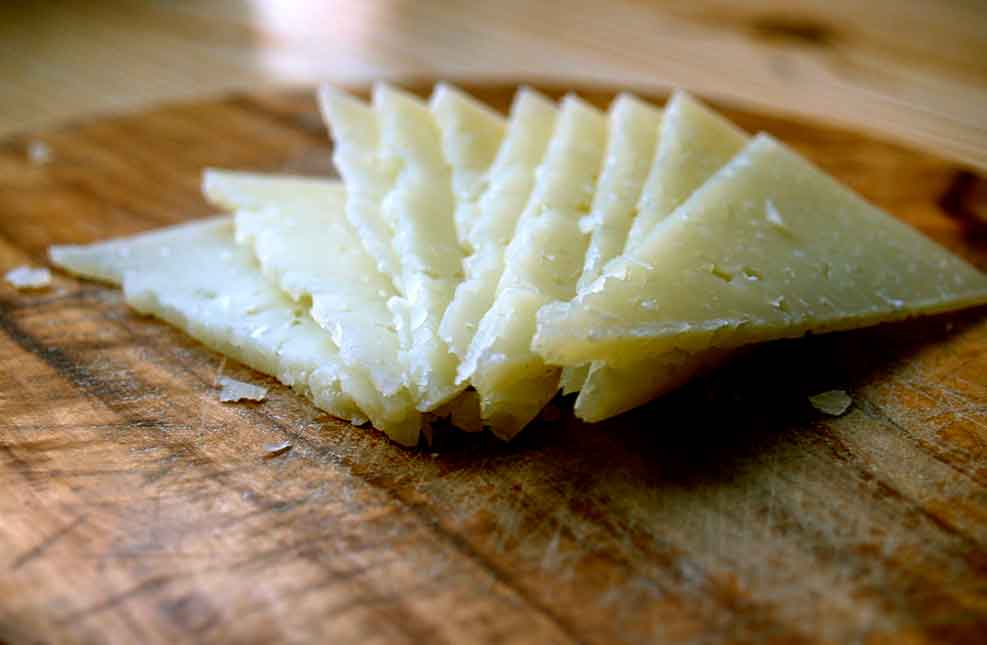 Manchego cheese, on a tapas plate. 