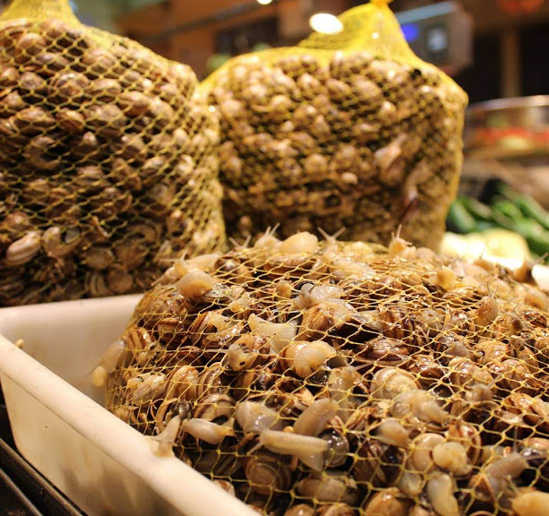 Snails for sale at a food market in Seville